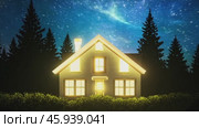 Family house gradually illuminating against a starry night sky. Стоковое видео, видеограф Данил Руденко / Фотобанк Лори