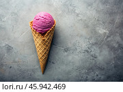 Sweet dessert. Ice cream cones with different flavors on a concrete gray background. World Ice Cream Day. Стоковое AI-изображение, AI-художник Photojuli / Фотобанк Лори