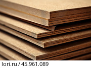 Stack of particle board showing wood grain and layers. Стоковое AI-изображение, AI-художник Иван Рябоконь / Фотобанк Лори