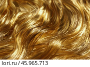 Golden strands flowing and glimmering, a luxurious abstract background. Стоковое AI-изображение, AI-художник Иван Рябоконь / Фотобанк Лори