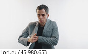 Worried man searching his pockets, looking for lost wallet or documents. Стоковое видео, видеограф Илья Шаматура / Фотобанк Лори