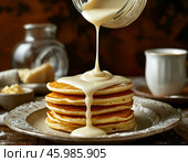 Pancakes with condensed milk. Pancake week. Maslenitsa is an Eastern Slavic traditional holiday celebrated a week before Lent. Стоковое AI-изображение, AI-художник Сергей Елизарьев / Фотобанк Лори