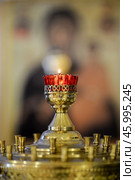 Lampada on a candlestick in an Orthodox church. Редакционное фото, фотограф Анна Никонорова / Фотобанк Лори