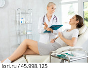Sick female patient having aches and visiting doctor. Стоковое фото, фотограф Яков Филимонов / Фотобанк Лори