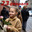 23 февраля - День защитника Отечества. Девочка поздравляет солдата на городской улице. Стоковое AI-изображение, AI-художник Татьяна Бакуменко / Фотобанк Лори