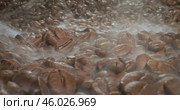 Close up of seeds of coffee. Fragrant coffee beans are roasted smoke comes from coffee beans. Стоковое видео, видеограф Андрей Армягов / Фотобанк Лори
