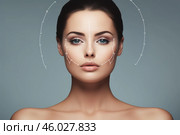 Facelift surgery concept with lifting lines demonstrating innovative rejuvenation treatment for beautiful woman. Стоковое AI-изображение, AI-художник Иван Рябоконь / Фотобанк Лори