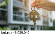 House Keys. Keys from new housing, dwellings among blurred real estate, apartment building. Relocation. Open entrance door, house shaped keychain. Door Keyring. Real estate, agent, insurance, property. Стоковое AI-видео, аниматор Марина Демидюк / Фотобанк Лори