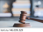 Judge's gavel on table in office. Стоковое фото, фотограф Pixel_shot / Фотобанк Лори