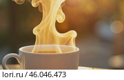 Cup of Coffee on a wooden cafe table, autumn nature background. Outdoor. Copy space. Hot steamed coffee mug. Rest, breakfast, vacations concept. Fall in garden backyard. Relax time. October sunlight. Стоковое AI-видео, аниматор Марина Демидюк / Фотобанк Лори