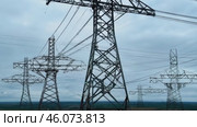 Overhead line pylons, high voltage pylons. Power transmission towers and lines at sunset. A shot of high voltage electric transmission tower, also known as electricity pylon. Стоковое видео, видеограф ALLA YURTAYEVA / Фотобанк Лори