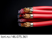 Copper electrical cable wires showing stranded copper conductors on black background. Стоковое AI-изображение, AI-художник Иван Рябоконь / Фотобанк Лори