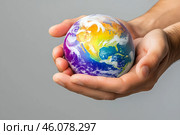 Планета Земля в ладонях человека. Стоковое AI-изображение, AI-художник Щеголева Ольга / Фотобанк Лори