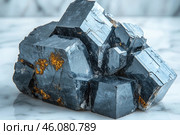 A metal crystal with a clearly defined cubic structure, reminiscent of pyrite or galena. The surface of the mineral is smooth, with a metallic luster, and there are also golden inclusions, which may indicate the presence of other elements, such as sulfur compounds or gold-bearing impurities. The stone lies on a marble surface, which emphasizes its geometric shape and luster. Стоковое AI-изображение, AI-художник Анна Кривицкая / Фотобанк Лори