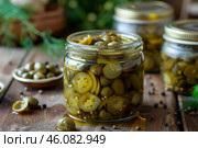 Pickled caper berries and sliced jalapenos preserved in glass jars. Стоковое AI-изображение, AI-художник Иван Рябоконь / Фотобанк Лори