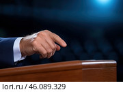 Hand of a speaker while speaking at the tribune, pointing his finger at the audience. Стоковое AI-изображение, AI-художник Евгений Харитонов / Фотобанк Лори