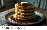Stacked pancakes drizzled with syrup and topped with a pat of butter on a rustic wooden table. Стоковое AI-изображение, AI-художник Сергей Толмачёв / Фотобанк Лори