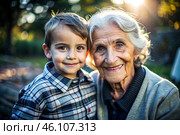 A happy family, a child and a grandmother hug on the street in the park, happy and contented. A grandmother who hugs her grandson, showing love. Стоковое AI-изображение, AI-художник Photojuli / Фотобанк Лори