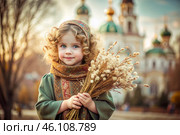 Christianity. Portrait of a three-year-old girl in a Russian folk shawl with a bouquet of wild grass in her hands against the background of an Orthodox church. Стоковое AI-изображение, AI-художник Photojuli / Фотобанк Лори