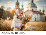 Christianity. Portrait of a three-year-old girl in a Russian folk shawl with a bouquet of wild grass in her hands against the background of an Orthodox church. Стоковое AI-изображение, AI-художник Photojuli / Фотобанк Лори