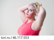 Plus size fashion model, fat woman on beige background, overweight female body. Стоковое фото, фотограф Станислав Тарко / Фотобанк Лори