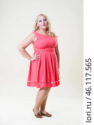 Plus size fashion model, fat woman on beige background, overweight female body. Стоковое фото, фотограф Станислав Тарко / Фотобанк Лори