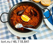 Racy seafood paella with mussels, calamari and prawns. Стоковое фото, фотограф Яков Филимонов / Фотобанк Лори