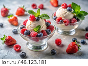 Sweet dessert. The love of ice cream. Vanilla ice cream balls and fresh strawberries, raspberries, and blueberries. Banner, advertisement. Стоковое AI-изображение, AI-художник Photojuli / Фотобанк Лори