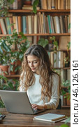 Young woman working on laptop in cozy library setting. Стоковое AI-видео, аниматор Юрий Поздников / Фотобанк Лори