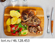 Roasted lamb leg served with grilled organic vegetable and peppe closeup. Стоковое фото, фотограф Яков Филимонов / Фотобанк Лори