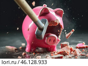 A hammer shattering a pink piggy bank, scattering coins and debris in a dramatic display of financial recklessness. Стоковое AI-изображение, AI-художник Sergey Grishin / Фотобанк Лори