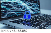 Cybersecurity concept with blue padlock over laptop keyboard. Стоковое видео, видеограф Данил Руденко / Фотобанк Лори