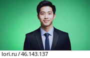 Businessman smiling confident on green screen. Male dressed in a stylish formal outfit. Professional millennial man isolated on green background. Chroma key backdrop. Headshot portrait. Presentation. Стоковое AI-видео, аниматор Марина Демидюк / Фотобанк Лори