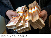 A few packs of rubles in the hands of a woman. Стоковое фото, фотограф Дмитрий Коростылев / Фотобанк Лори