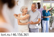 Senior woman practicing samba with man during dance class. Стоковое фото, фотограф Яков Филимонов / Фотобанк Лори