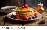 Delicious pancakes with honey, blueberries, raspberries and . The concept of the Russian holiday Maslenitsa. Стоковое AI-изображение, AI-художник Photojuli / Фотобанк Лори