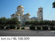 Bar, Montenegro 07.20.24: The Church of St. Jovan Vladimir is a Serbian Orthodox Church, located in the city center, near the coastline. A majestic snow-white building with gilded domes and bells. (2024 год). Редакционное фото, фотограф Юлия Петровская / Фотобанк Лори