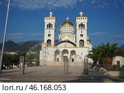 Bar, Montenegro 07.20.24: The Church of St. Jovan Vladimir is a Serbian Orthodox Church, located in the city center, near the coastline. A majestic snow-white building with gilded domes and bells. (2024 год). Редакционное фото, фотограф Юлия Петровская / Фотобанк Лори