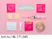 Different contraceptives on color background. Стоковое фото, фотограф Pixel_shot / Фотобанк Лори