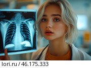 Молодая женщина врач с рентгеновским снимком больного человека. Стоковое AI-изображение, AI-художник Щеголева Ольга / Фотобанк Лори