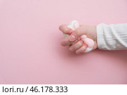 Taba paw pink and white colorful anti-stress toys squirt on baby's hand. Стоковое фото, фотограф Терехова Марина / Фотобанк Лори