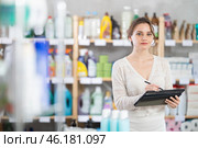 Woman employee with tablet plans to replenish restock stores inventory. Стоковое фото, фотограф Яков Филимонов / Фотобанк Лори