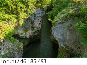 A picturesque natural corridor in a limestone formation laid by the course of the Belaya River - Khadzhokhskaya Gorge (Kamennomost Canyon) on a summer day, Kamennomostsky, Republic of Adygea, Russia. Стоковое фото, фотограф Ula Ulachka / Фотобанк Лори