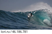 Skilled surfer riding huge ocean waves montage. Стоковое видео, видеограф Данил Руденко / Фотобанк Лори