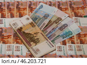 Денежный фон из пятитысячных купюр, купюры 50, 100, 500 и 1000 рублей / The monetary fund consists of five thousand banknotes, notes of 50, 100, 500 and 1000 rubles. Стоковое фото, фотограф Петроченко Мария Петровна / Фотобанк Лори