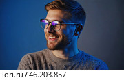 Portrait of smiling man with glasses. Guy laughs, squinting his eyes. Стоковое AI-изображение, AI-художник Ирина / Фотобанк Лори