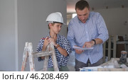 Father and son discussing completed work in renovated room. Стоковое видео, видеограф Яков Филимонов / Фотобанк Лори