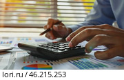 Man pressing calculator close up. Desk with diagram, graph, finance. Investment, accounting, calculating tax, corporate financial company report. Person checking bills, bank account balance, expenses. Стоковое AI-видео, аниматор Марина Демидюк / Фотобанк Лори