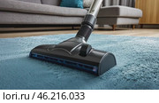 Cleaning blue carpet with vacuum cleaner at home. Living space. Professional Vacuuming a Soft Rug in Apartment. Modern Stylish Living Room Space Background. Clean Sweep. House work. Cleaning Service. Стоковое AI-видео, аниматор Марина Демидюк / Фотобанк Лори