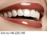 Beautiful Smile. Female smiling, perfect white teeth, close up. Healthy smiles. Perfect teeth of smiling young woman on a white background. Whitening. Dental clinic patient. Oral care, dentistry. Стоковое AI-изображение, AI-художник Марина Демидюк / Фотобанк Лори